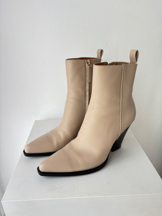 Pair of beige Alias Mae Tayla ankle boots on a white background